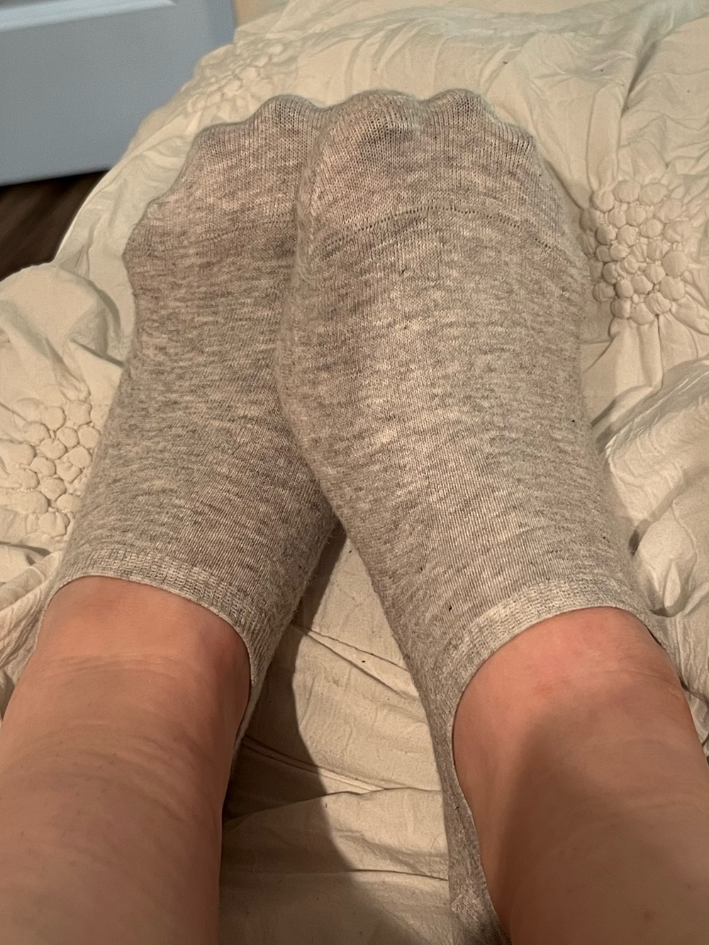 well worn grey ankle socks